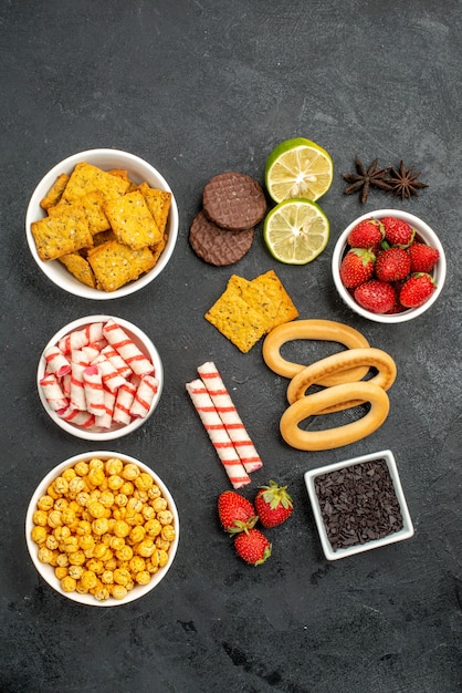 Free Photo top view different eatings crackers fruits and candies