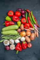 Free photo top view different fresh vegetables on dark table vegetable fresh salad ripe