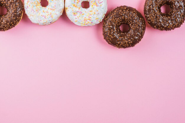 Top view of different glazed donuts