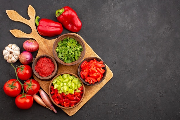 Top view different vegetables with greens on grey background salad meal health ripe spicy