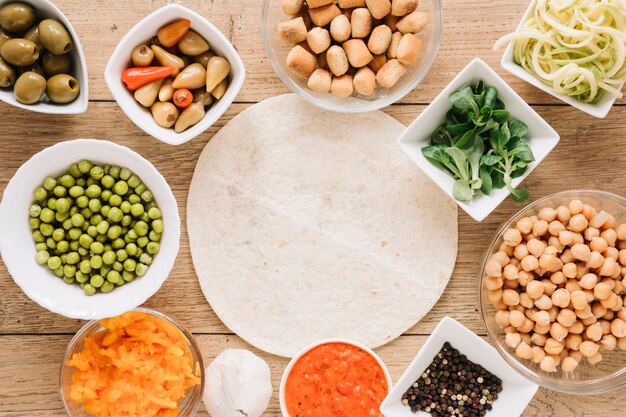 Top view of dishes with chickpeas and green peas