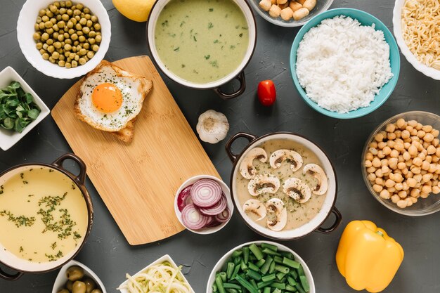 Top view of dishes with fried egg and mushroom soup