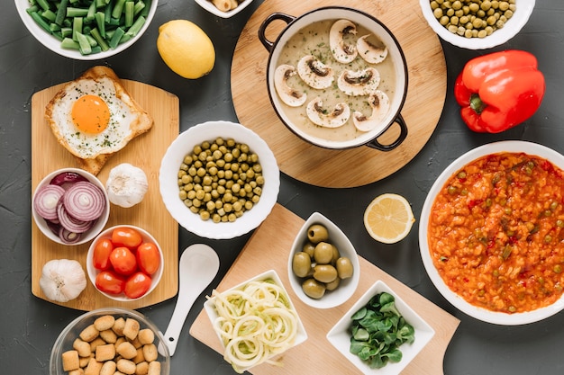 Top view of dishes with mushrooms and fried egg