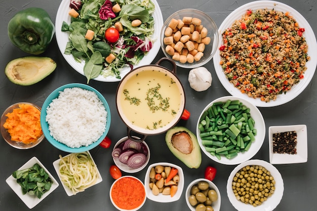 Top view of dishes with soup and hummus