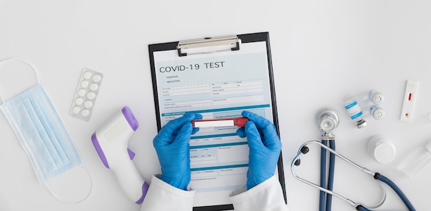 Top view doctor checking covid test