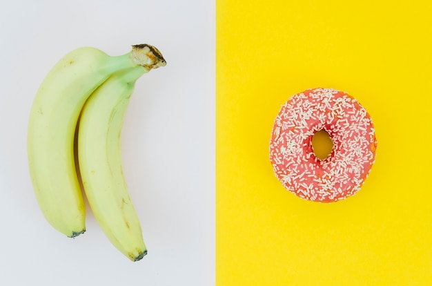 Top view donut vs fruit