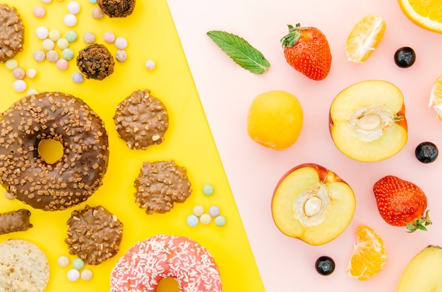 Top view donut vs fruit