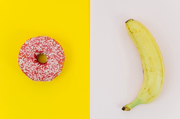 Top view donut vs fruit