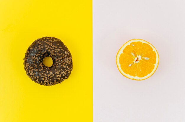 Top view donut vs fruit