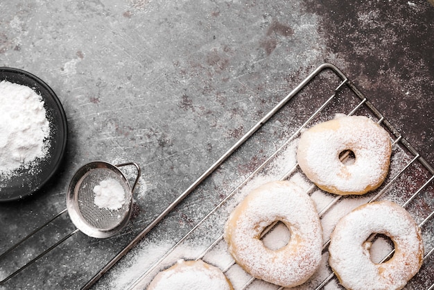 Free Photo top view donuts with sugar powder