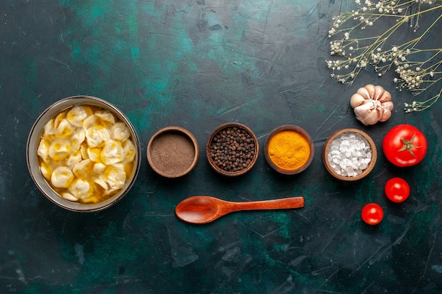 Top view dough soup with different seasonings on the blue background ingredient soup food meal dough dinner sauce