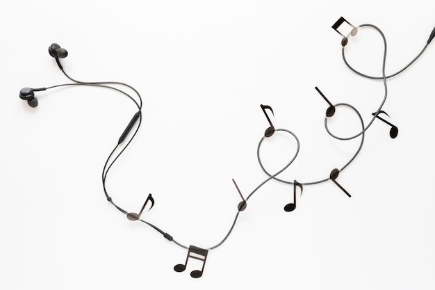 Free photo top view earbuds with musical notes