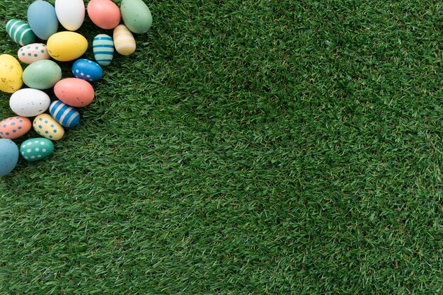 Top view of easter eggs on grass surface