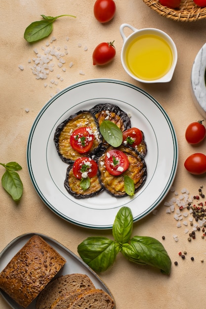 Free photo top view of eggplant dish with sauce and basil