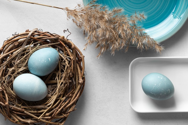 Top view of eggs for easter with nest made of twigs