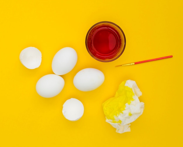 Free photo top view of eggs for easter with paint on napkin