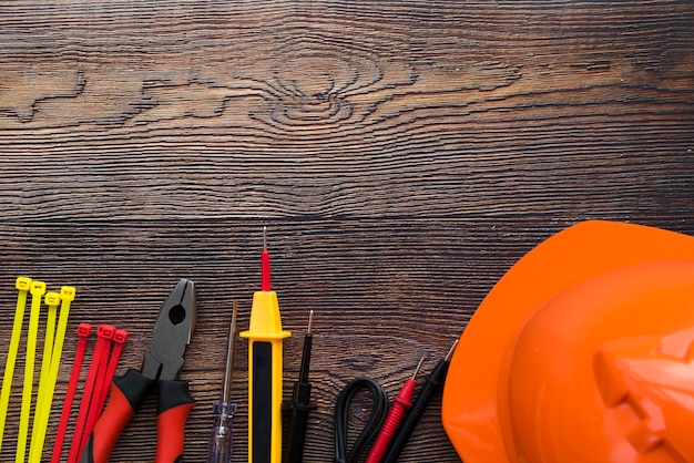 Top view of electric equipment on wooden background