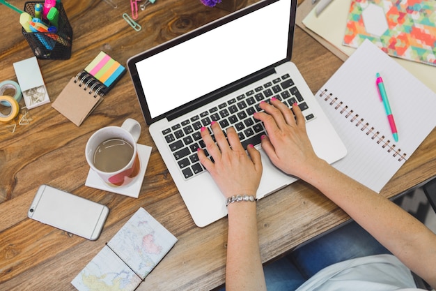 Top view of employee working with her laptop