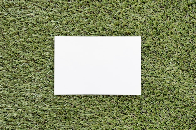 Free Photo top view empty card on green grass