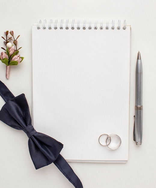 Free Photo top view empty copy space notebook and bow tie