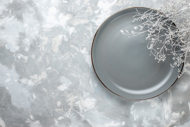 Free photo top view of empty grey plate on white, plate kitchen cutlery desk,