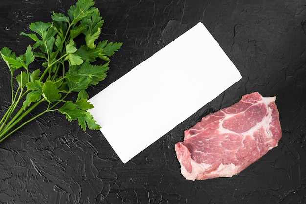 Free photo top view of empty menu paper with meat