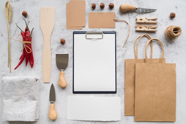 Top view of empty menu with paper bags and chili peppers