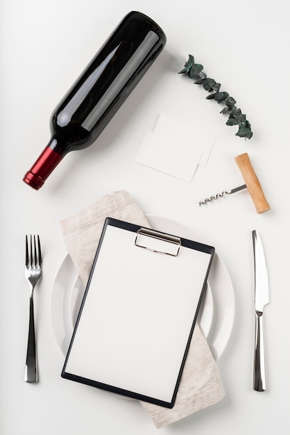 Free Photo top view of empty menu with wine and corkscrew