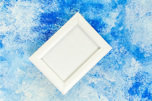 Top view empty white frame on blue white grunge