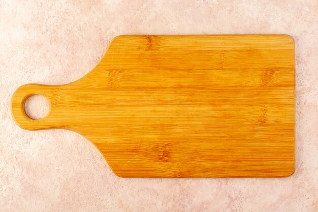 A top view empty wooden desk brown isolated on the pink background wood tree table