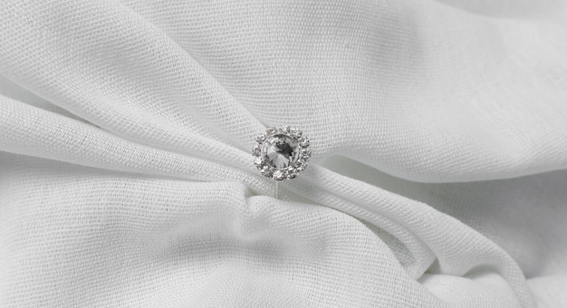 Free photo top view engagement ring and cloth