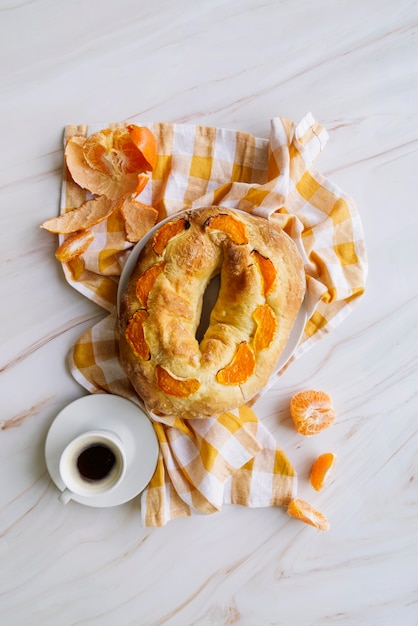 Free photo top view of epiphany day dessert with oranges and coffee