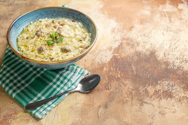 Top view erishte in bowl spoon on beige background