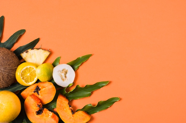 Top view exotic fruits on the table with copy space