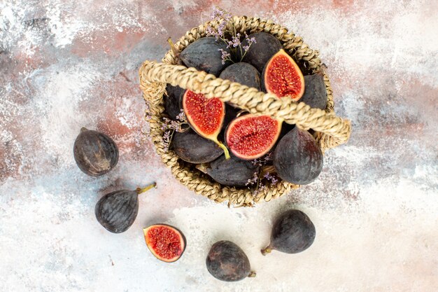 Top view fig basket figs on grey background