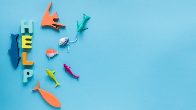 Top view of fish figurines with message and copy space