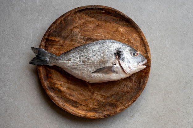 Free Photo top view fish ready to be cooked