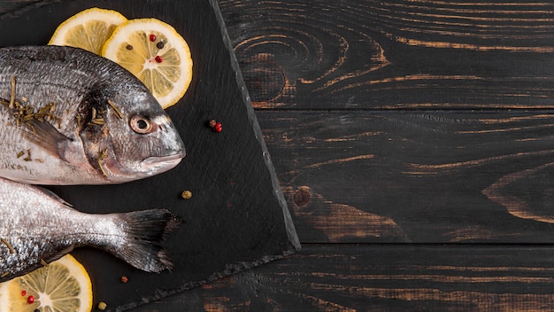 Top view fish and slices of lemon