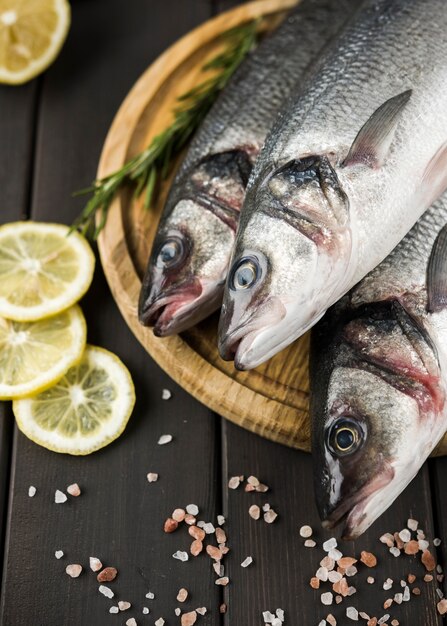 Top view fish with lemon and salt