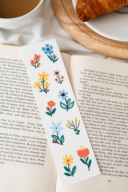 Top view floral bookmark on book