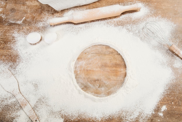 Top view of flour on wooden surface