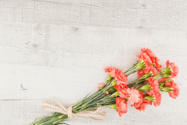 Top view flower bouquet on wooden background