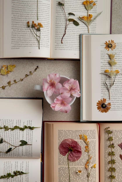 Free Photo top view flower press with books