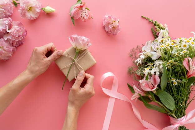 Top view of flowers bouquet with gift