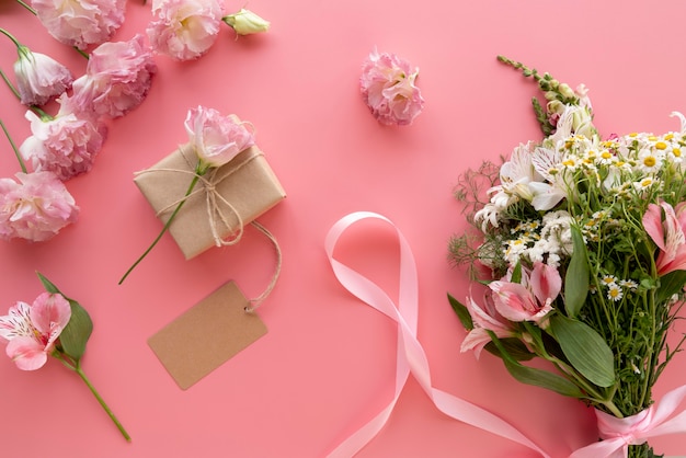 Top view of flowers bouquet with gift