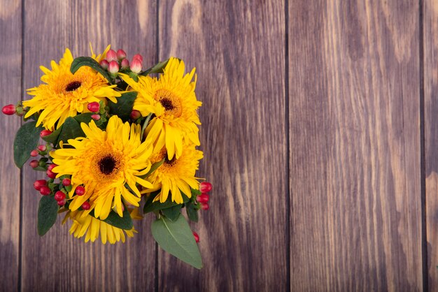 Top view of flowers on wood with copy space