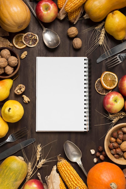 Top view food arrangement with notebook