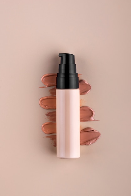 Free photo top view foundation bottle advertising