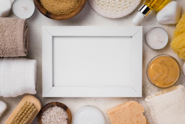 Top view frame surrounded by towels and candels