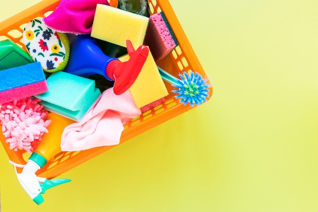 Top view frame with basket with cleaning products